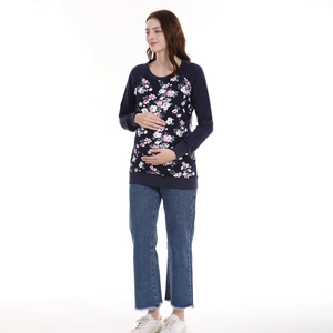 Floral maternity nursing sweatshirt in navy blue paired with fringed denim jeans
