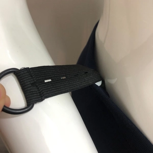 Detailed view of adjustable elastic waistband with buttonholes for maternity pants