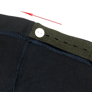 Adjustable high waist band for maternity pants featuring white buttons and elastic strap