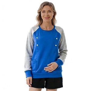 Detail of raglan sleeves and button accents on blue and grey patchwork maternity hoodie