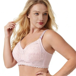Close-up of pink lace nursing bra with full cup design and elegant wave pattern lace detail