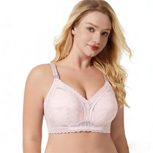 Close-up of light pink lace nursing bra featuring fine floral patterns and scalloped edges