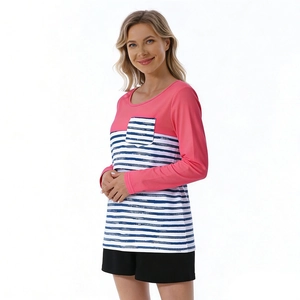Close-up of pink and striped nursing top with functional breastfeeding opening detail