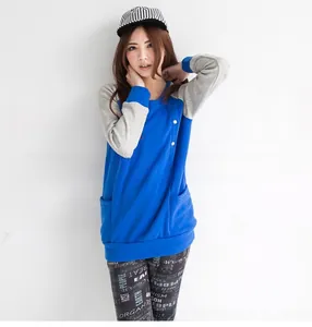Detail of color-block nursing sweatshirt with buttons and pockets for winter maternity wear