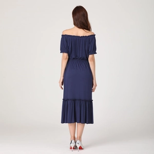 Rear view of a navy blue off-shoulder maternity dress with ruffled hem and waist detail