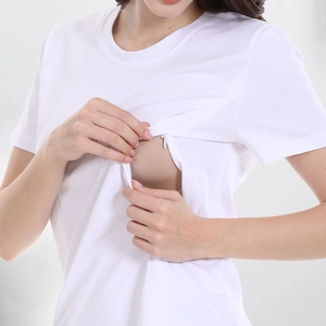 Detail of white cotton nursing t-shirt showing concealed zipper for breastfeeding access