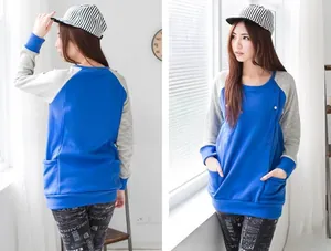Detail view of winter maternity hoodie with color-block sleeves and button collar