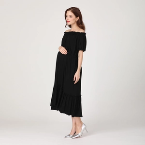 Side view of black off-the-shoulder maternity dress with ruffled hem and bubble sleeves