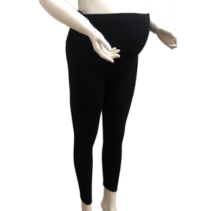 Detail view of high waist maternity leggings featuring elastic belly support band
