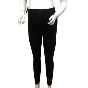 Close-up of maternity leggings featuring a high-waisted belly support elastic design