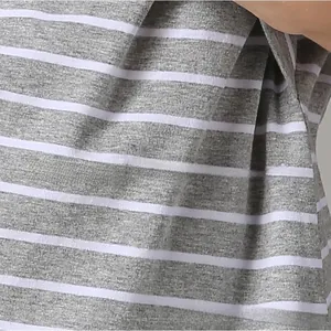 Close-up of grey and white striped soft cotton fabric texture for maternity nursing tops