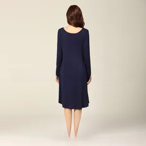Rear view of a dark blue maternity dress showing loose fit and soft fabric texture