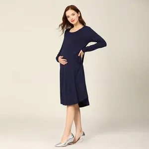 Detail of navy blue long sleeve maternity dress with soft knit fabric and loose fit