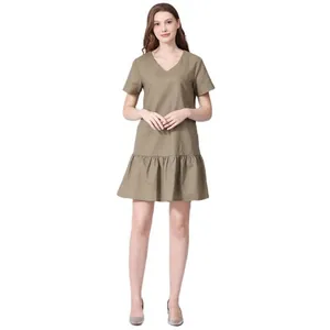Detail view of army green V-neck maternity dress with ruffled hem and loose cotton fit