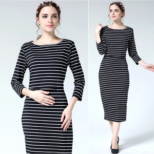 Detail of slim fit black and white striped maternity dress with classic crew neck