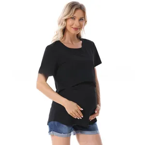Detail of breastfeeding opening on a black short-sleeved maternity T-shirt with high elasticity