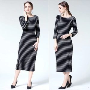 Front and side view of slim fit black and white striped maternity dress with 3/4 sleeves