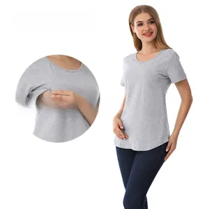Dettaglio dell'apertura laterale con zip nascosta su una t-shirt grigia da allattamento