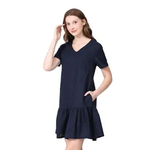 Detail of navy blue V-neck maternity dress with ruffled hem and functional side pockets