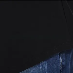 Close-up of nursing top hem stitching detail and cotton fabric texture on denim