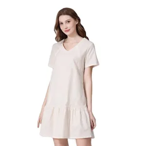 Detail of V-neckline and soft cotton-linen fabric on loose maternity feeding dress