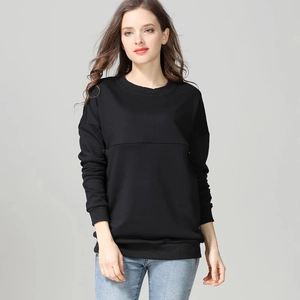 Detail view of the soft ribbed cuffs and high-weight fabric of this black nursing sweatshirt