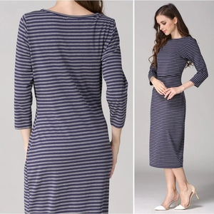 Detail of striped maternity nursing dress featuring navy and grey knit fabric textures