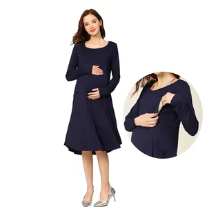 Navy blue long sleeve maternity nursing dress with a round neck and A-line silhouette