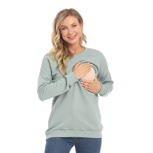 Close-up of nursing openings on the sage green cotton maternity sweatshirt