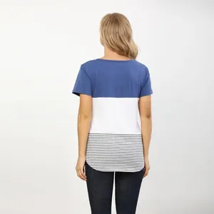 Close-up of maternity top showing navy, white, and striped cotton patchwork fabric detail