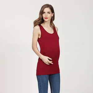 Detailed view of the stretchy modal fabric on a burgundy maternity tank top