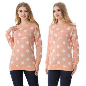 Detail of pink polka dot nursing sweatshirt featuring horizontal breastfeeding opening