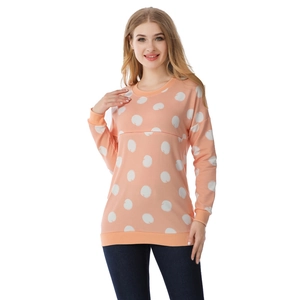 Close-up of nursing sweatshirt featuring hidden breastfeeding openings and white polka dots
