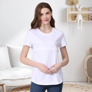 White cotton short sleeve nursing top for breastfeeding in a cozy home setting