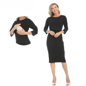 Detail view of the nursing opening on this long-sleeve black maternity midi dress
