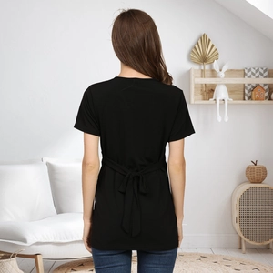 Detail of black maternity T-shirt showing back self-tie bow and soft elastic fabric