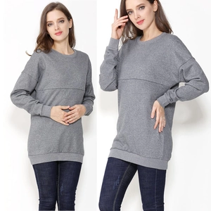 Detail of grey maternity sweatshirt with horizontal breastfeeding zipper and cotton fabric