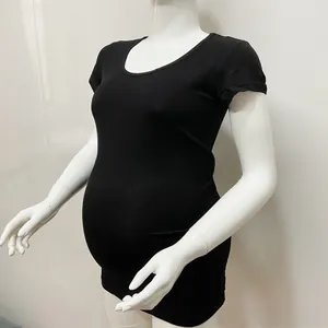 Side view of black maternity T-shirt with round neck and stretchy slim fit on mannequin