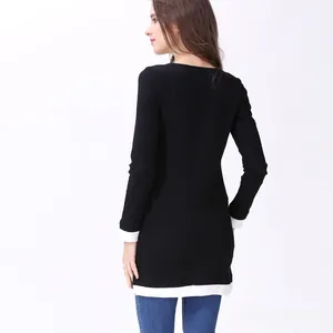 Dettaglio maglia premaman nera per allattamento con polsini e fondo a costine bianche