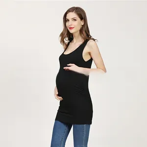 Side view of black maternity tank top with side ruching detail for pregnant belly curve