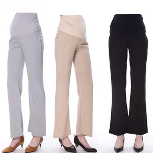 Detail view of high waist maternity pants in gray, beige and black elastic fabrics