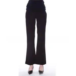 Detail of high-waisted black maternity pants featuring elastic belly support band