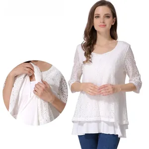 Detail of white floral lace nursing top with layered breastfeeding opening feature