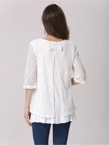 Back view of nursing top featuring lace bodice, slit back design and bow tie detail