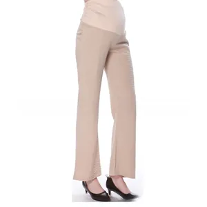 Detail of high waist maternity pants with wide elastic support band in beige fabric
