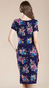 Back view of bodycon floral maternity dress in navy blue with colorful flower print