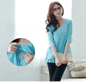 Close-up of the concealed nursing opening on this light blue lace maternity t-shirt