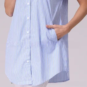 Detail of blue striped maternity shirt showing buttoned front and side pocket texture