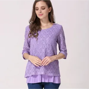 Detail of purple lace nursing top with layered chiffon hem and floral hollow design