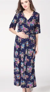Detail of V-neck floral maternity maxi dress with adjustable waist belt in navy blue